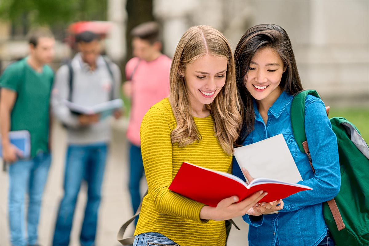 Students studying or a map of Canada